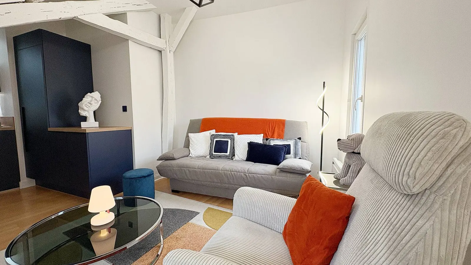 Lounge with sofa, armchair and glass coffee table