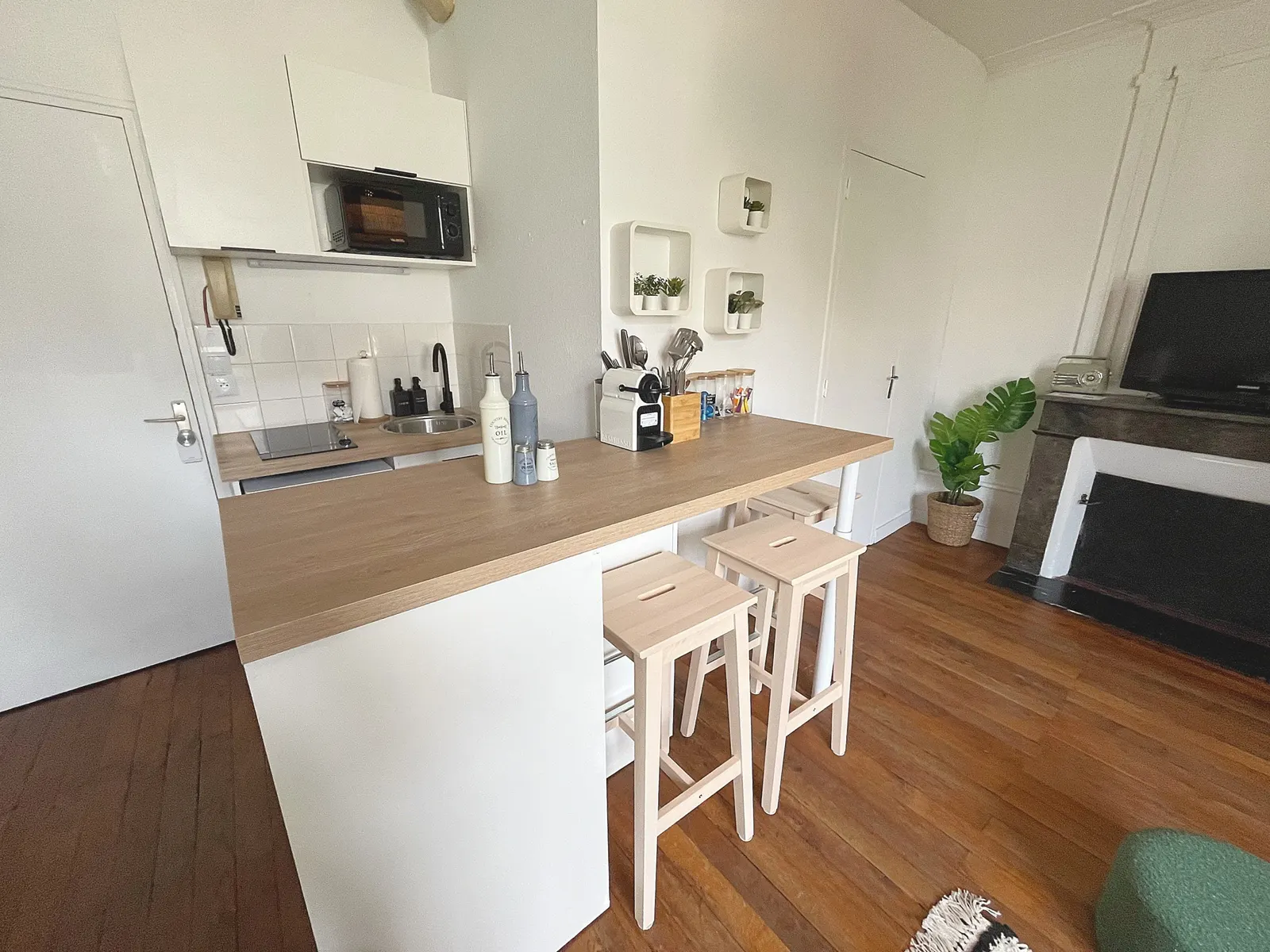Open kitchen with breakfast bar and stools
